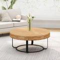 Table basse ronde moderne avec motif en bois sculpté et pieds en métal