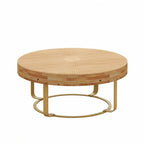 Table basse ronde moderne avec motif en bois sculpté et pieds en métal