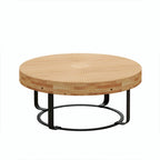 Table basse ronde moderne avec motif en bois sculpté et pieds en métal